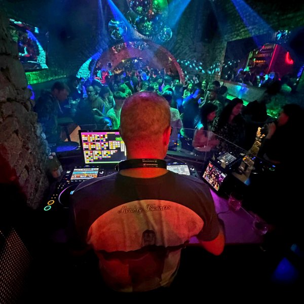 DJ booth perspective with blue lighting